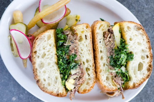 Porchetta, Marinated Squash, Mustard Greens, and Pickles on Ciabatta from Stuart Tracy of Butcher & Bee Porchetta, Marinated Squash, Mustard Greens, and Pickles on Ciabatta